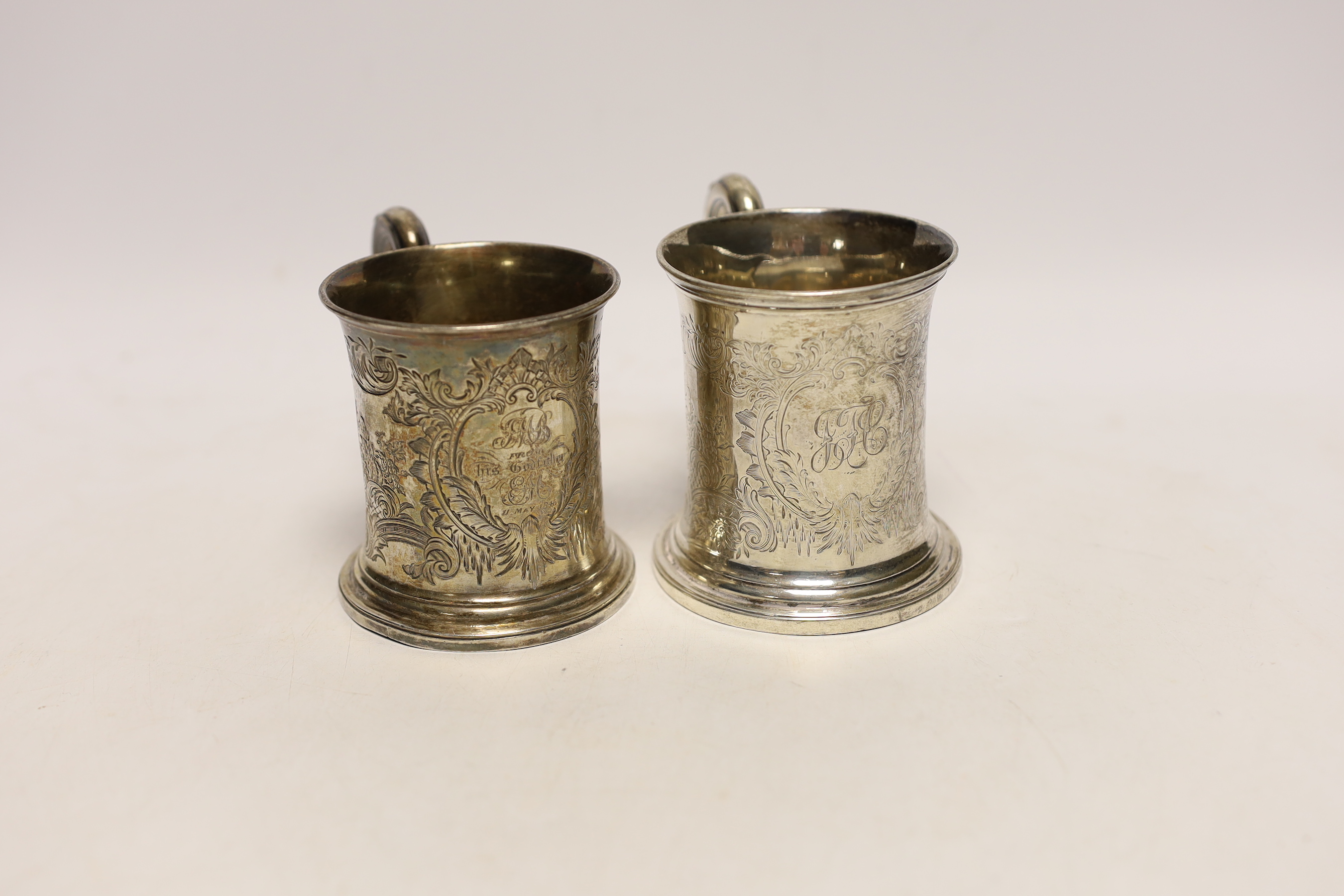 Two Victorian engraved silver christening mugs, the smallest by The Barnards, London, 1845, 86mm, 9.8oz.